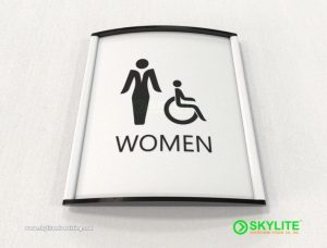 designed by benc mens womens restroom sign curved metal with metal inserts