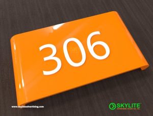 designed by benc room number sign laser cut acrylic on painted fabricated curved gi metal a2